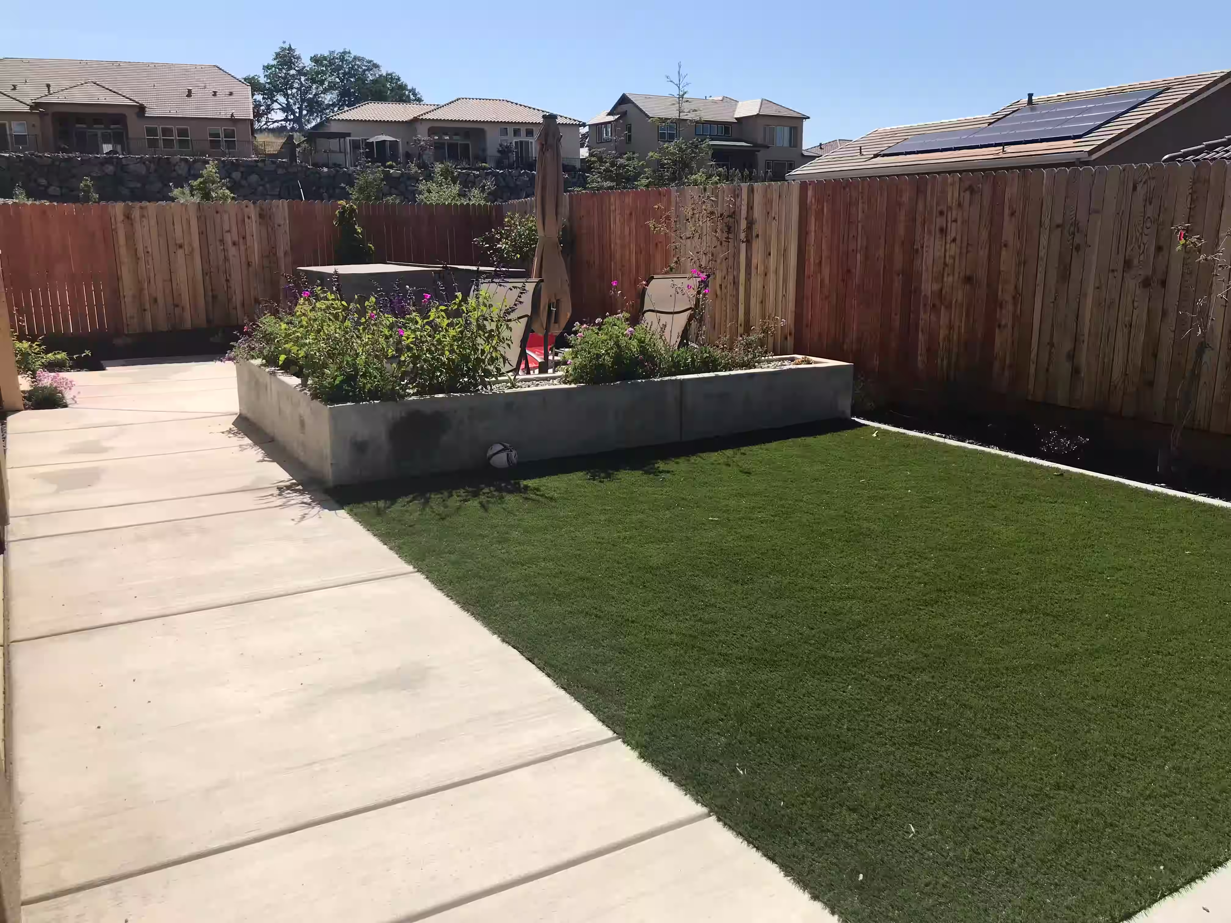 Low-maintenance artificial turf landscape