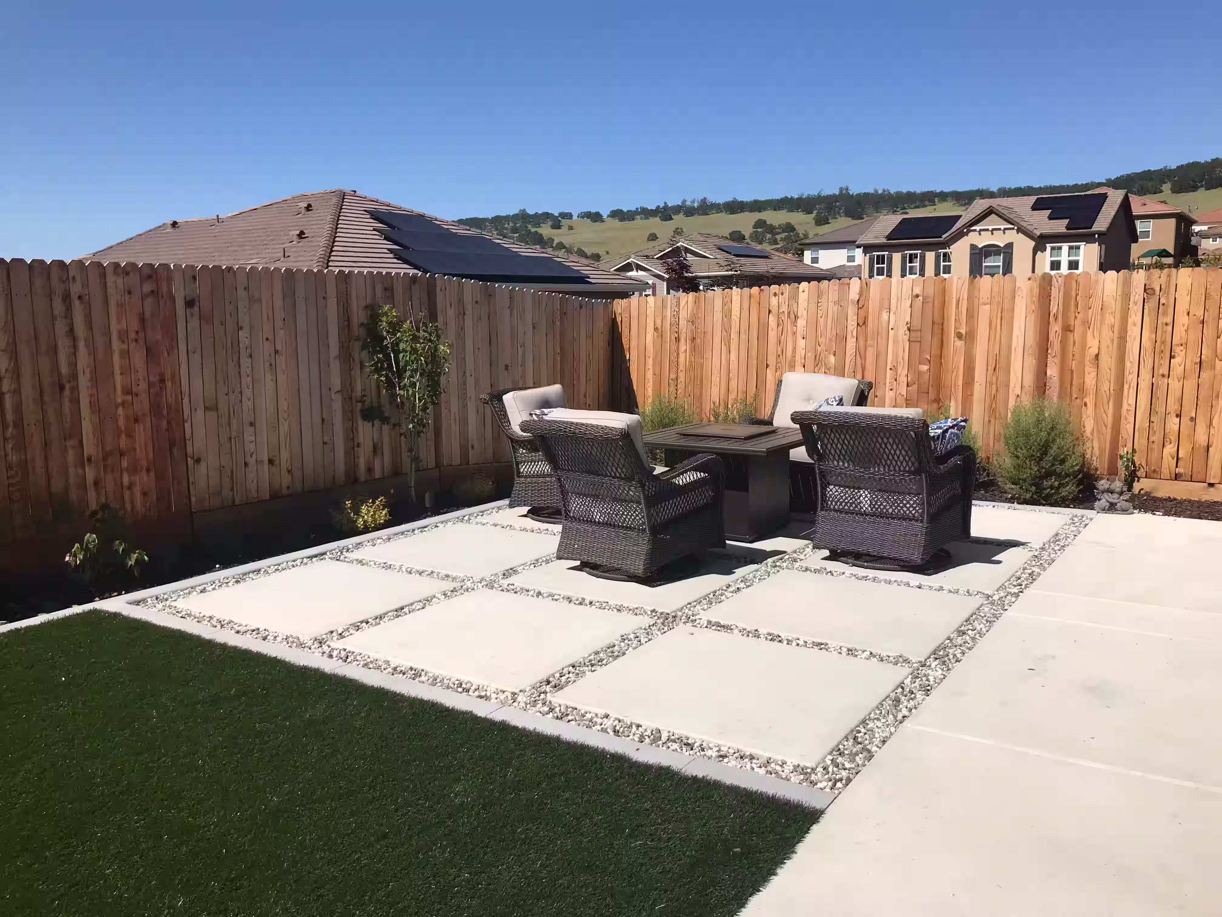 Outdoor renovation with artificial turf and a new seating area