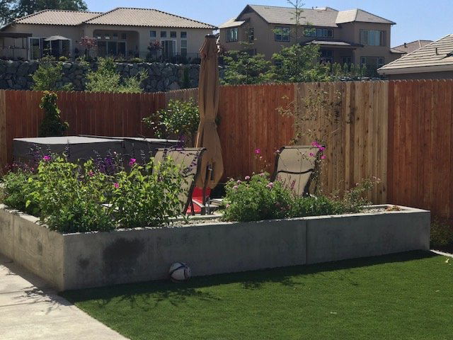 Concrete planter boxes with artificial turf