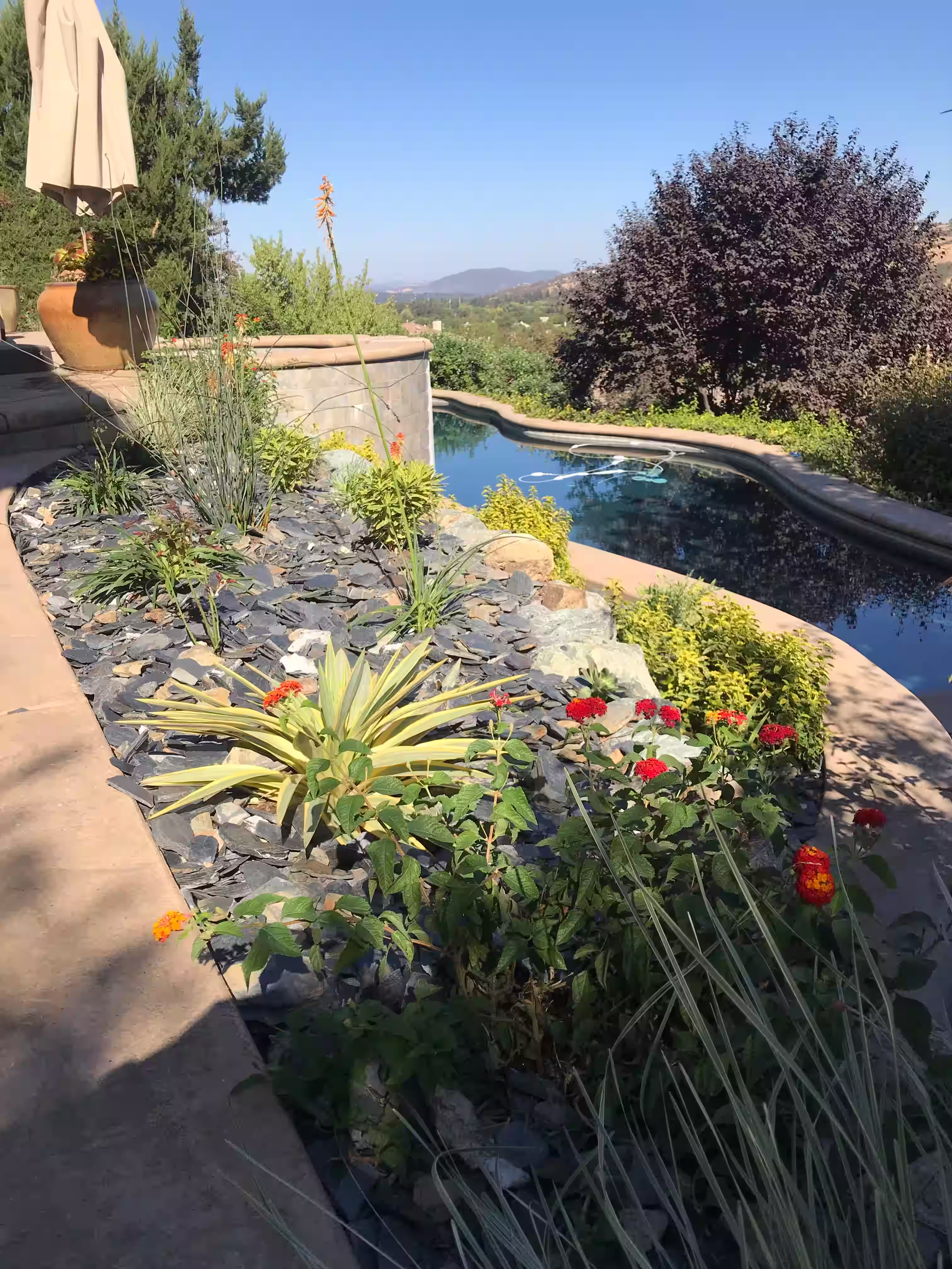 Brick and concrete retaining walls for poolside areas