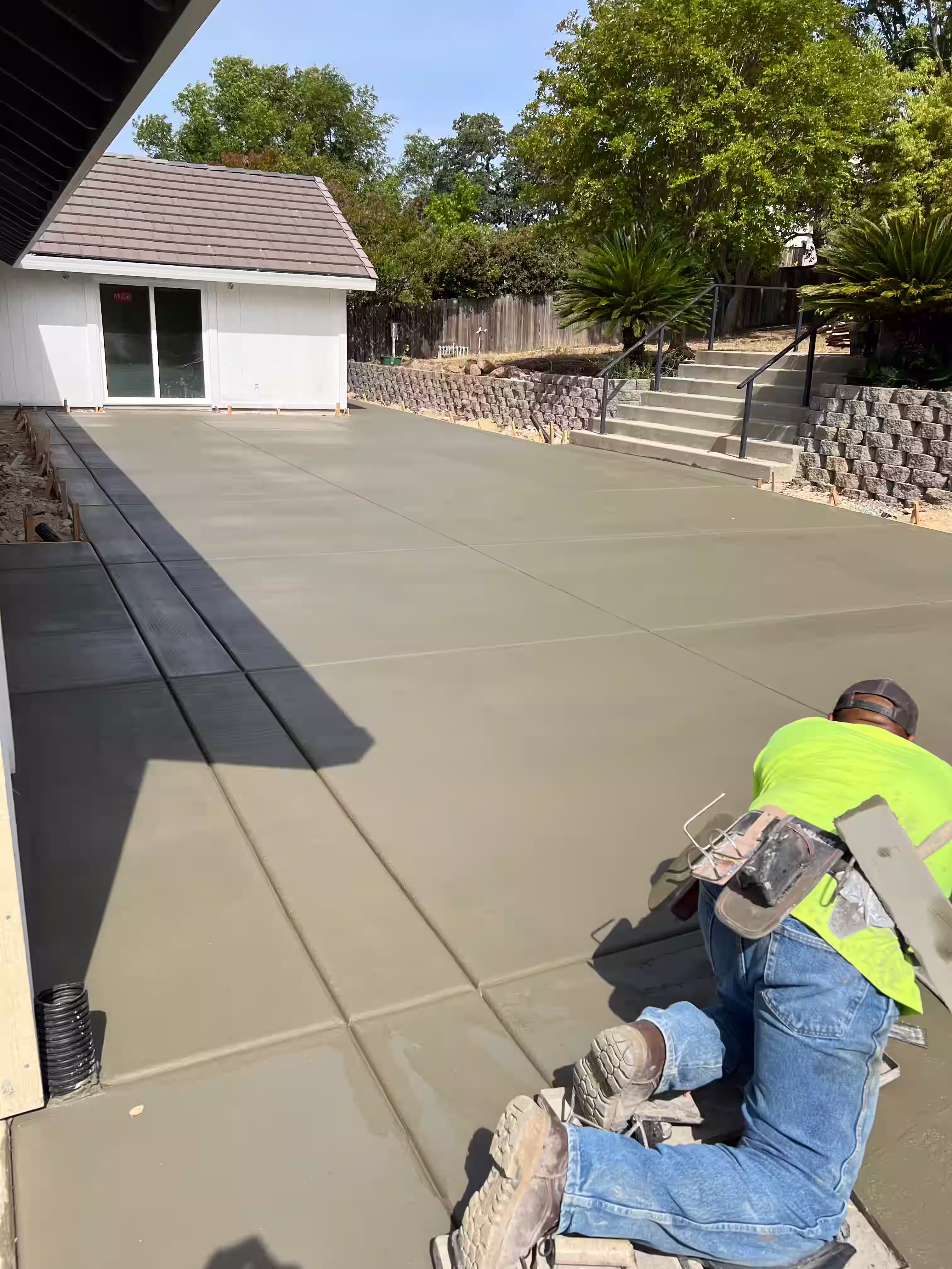 Concrete patio installation with modern design elements