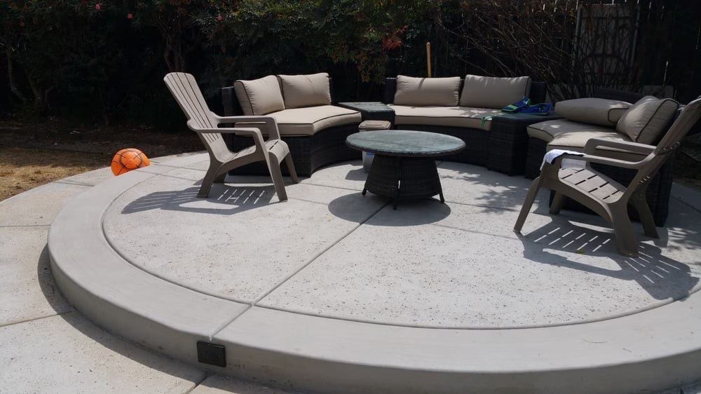 Poolside sitting area with lighting fixtures integrated