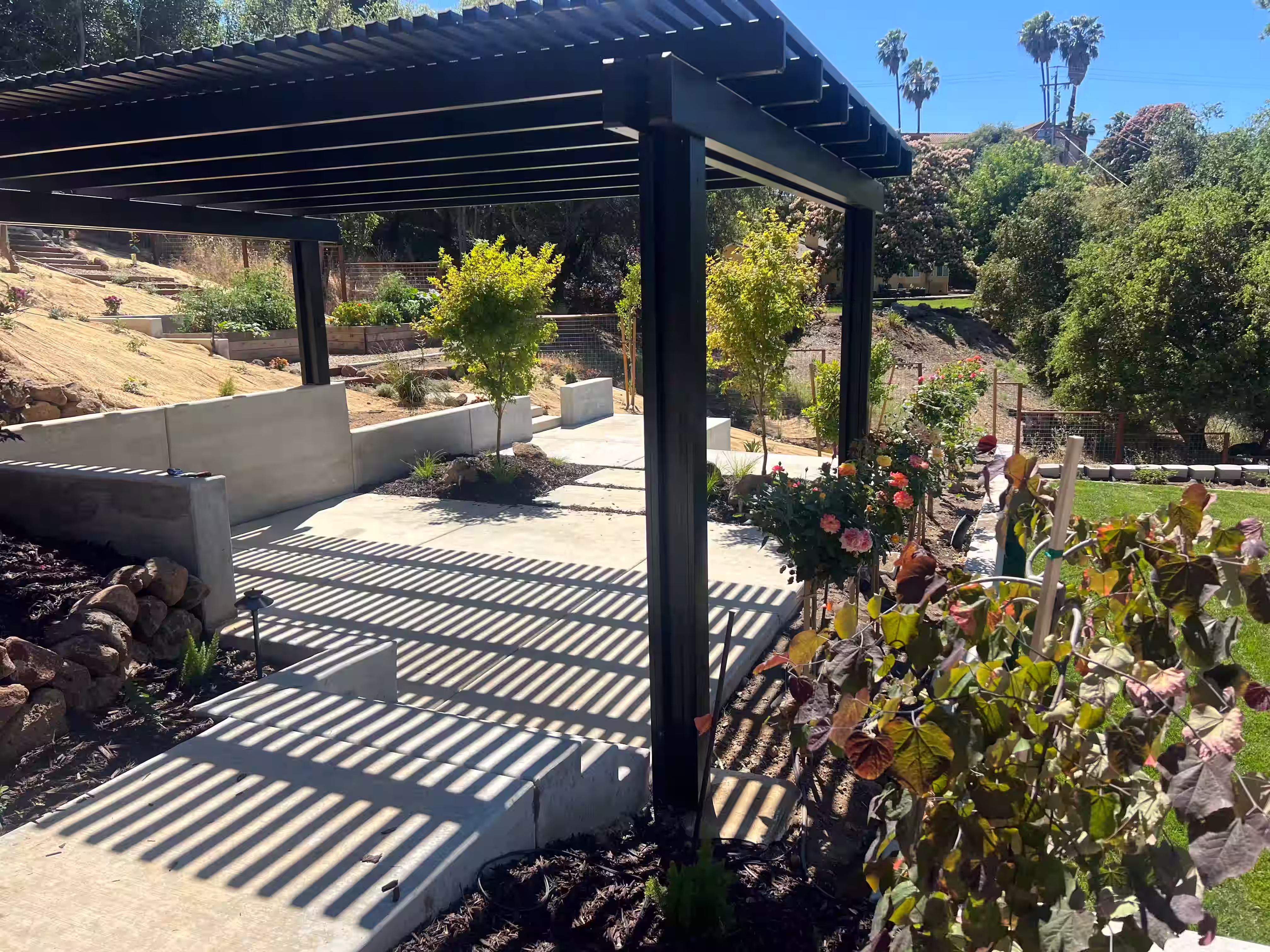 Concrete patio with metal pergola