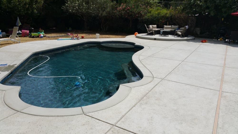 Poolside landscaping that doesn't compromise your yard's other uses